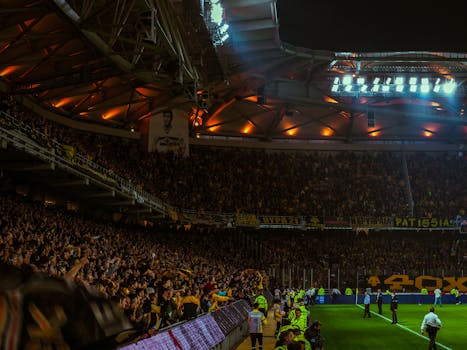 Football Fans Cheering on Stadium